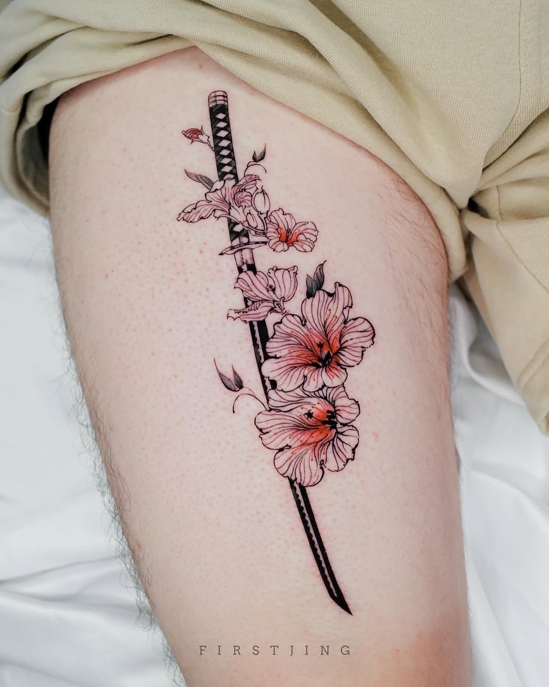 Sakura blossoms and katana japanese irezumi tattoo on the thigh by Seattle