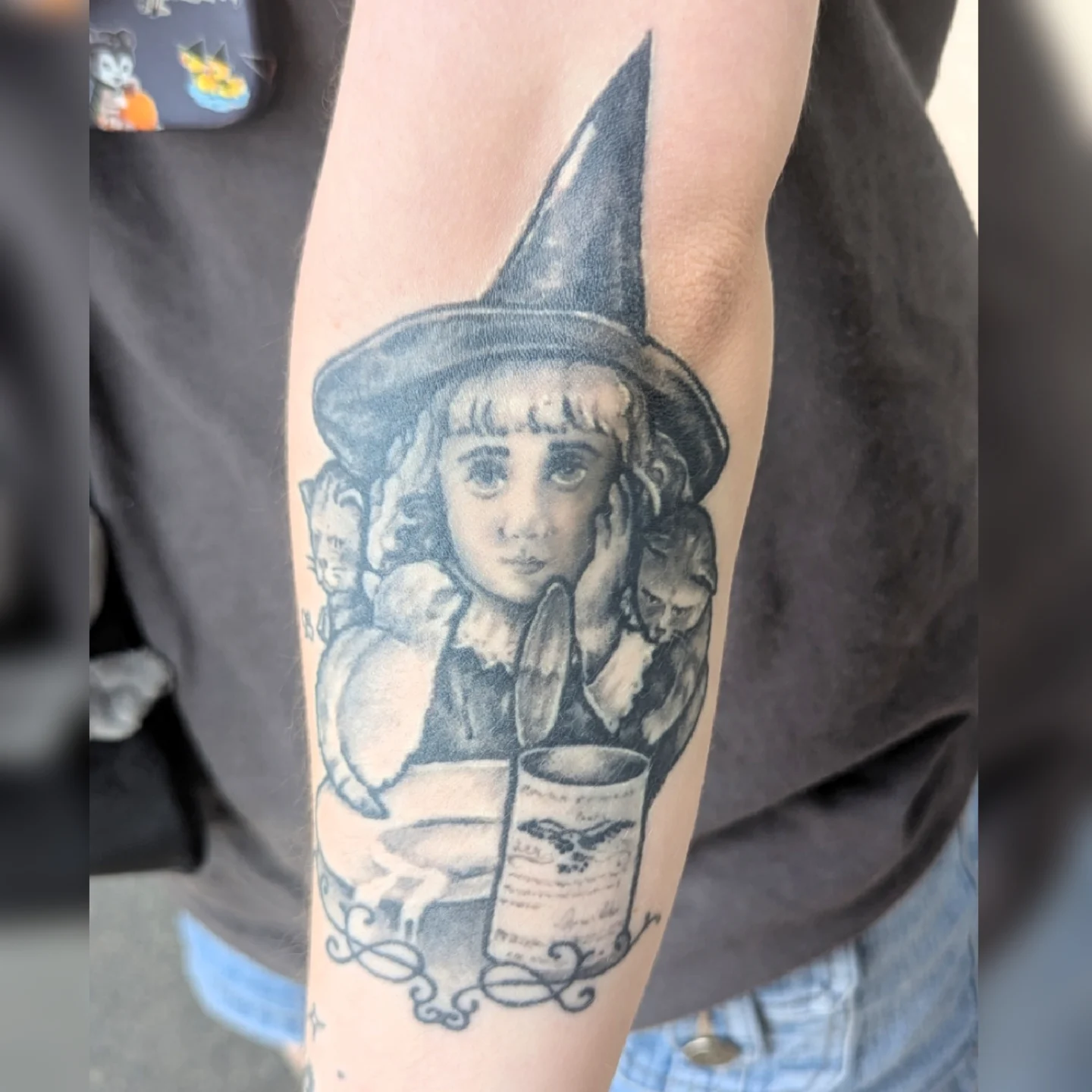 Witch black and grey tattoo on the forearm by Nason Dilts