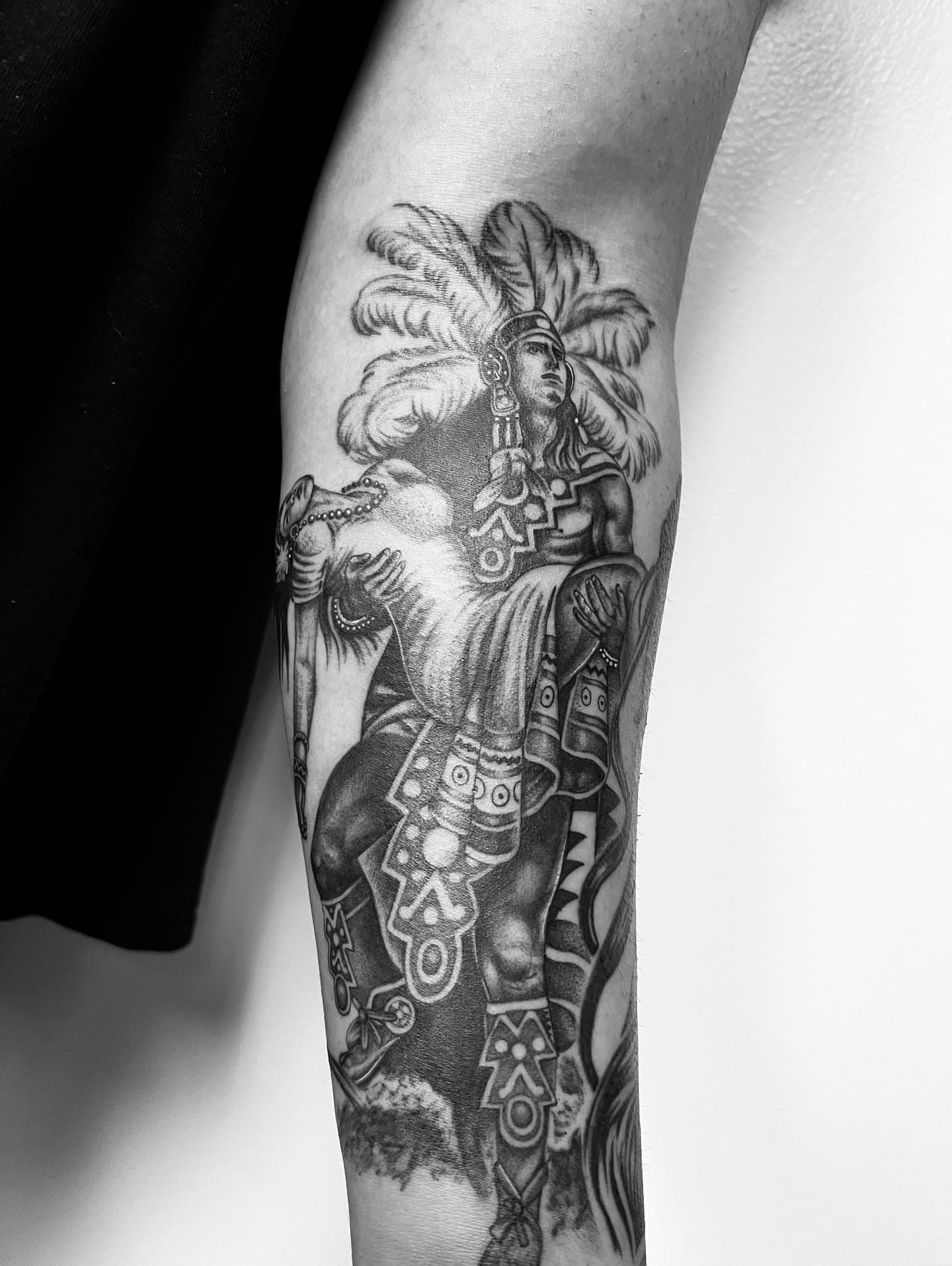 Indigenous warrior realism tattoo on the forearm by Hugo Ruiz-Esparza