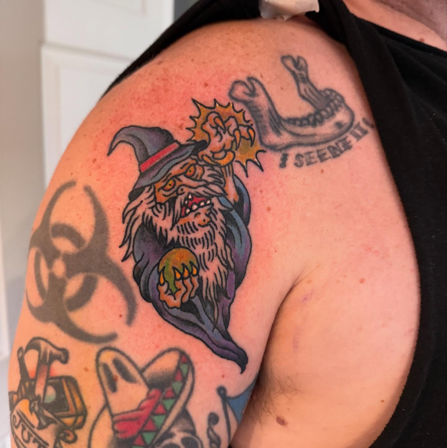 Wizard American traditional tattoo on the shoulder by Joe Truck