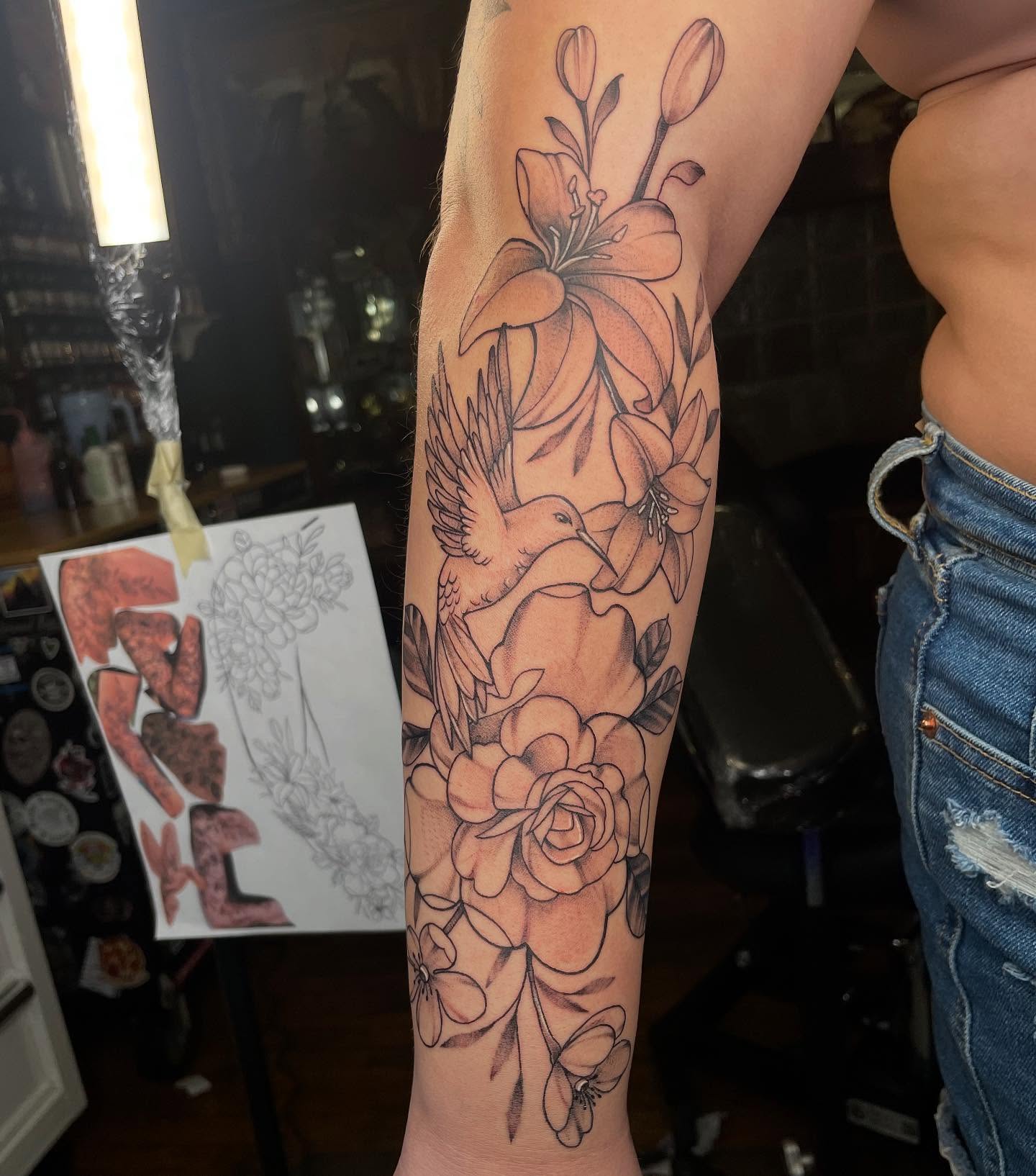 Floral bouquet black and grey tattoo on the forearm by Lauren Sisouphanh, Canton, Ohio