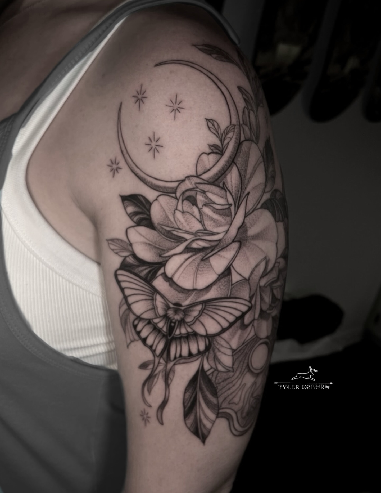 Rose and butterfly realism tattoo on the shoulder by Tyler Osburn