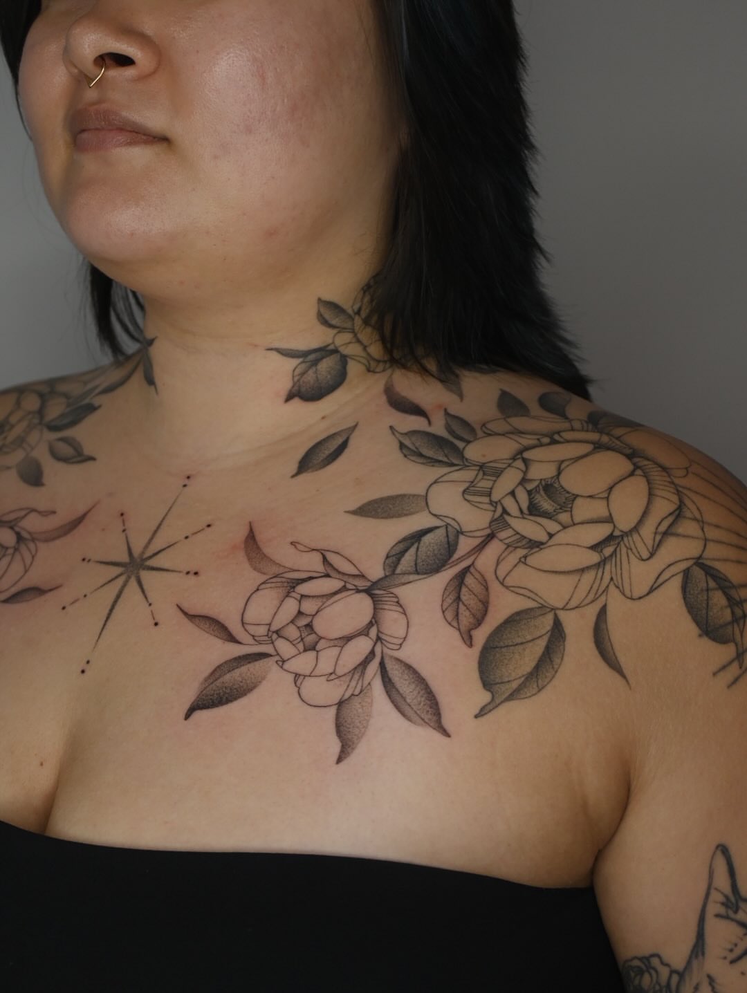 Flowers and star dotwork tattoo on the chest by Simba Nguyen