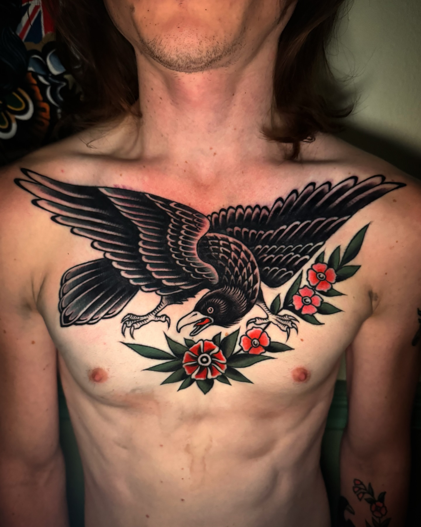 Raven and flowers American traditional tattoo on the chest by Pavel