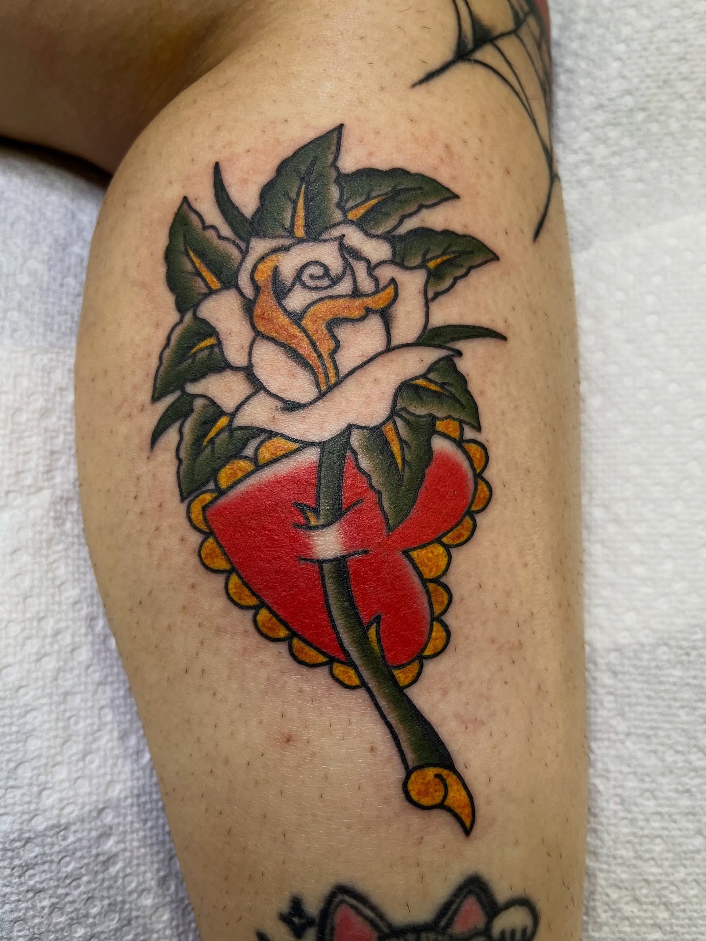 Rose and heart American traditional tattoo on the thigh by Pedroux M.