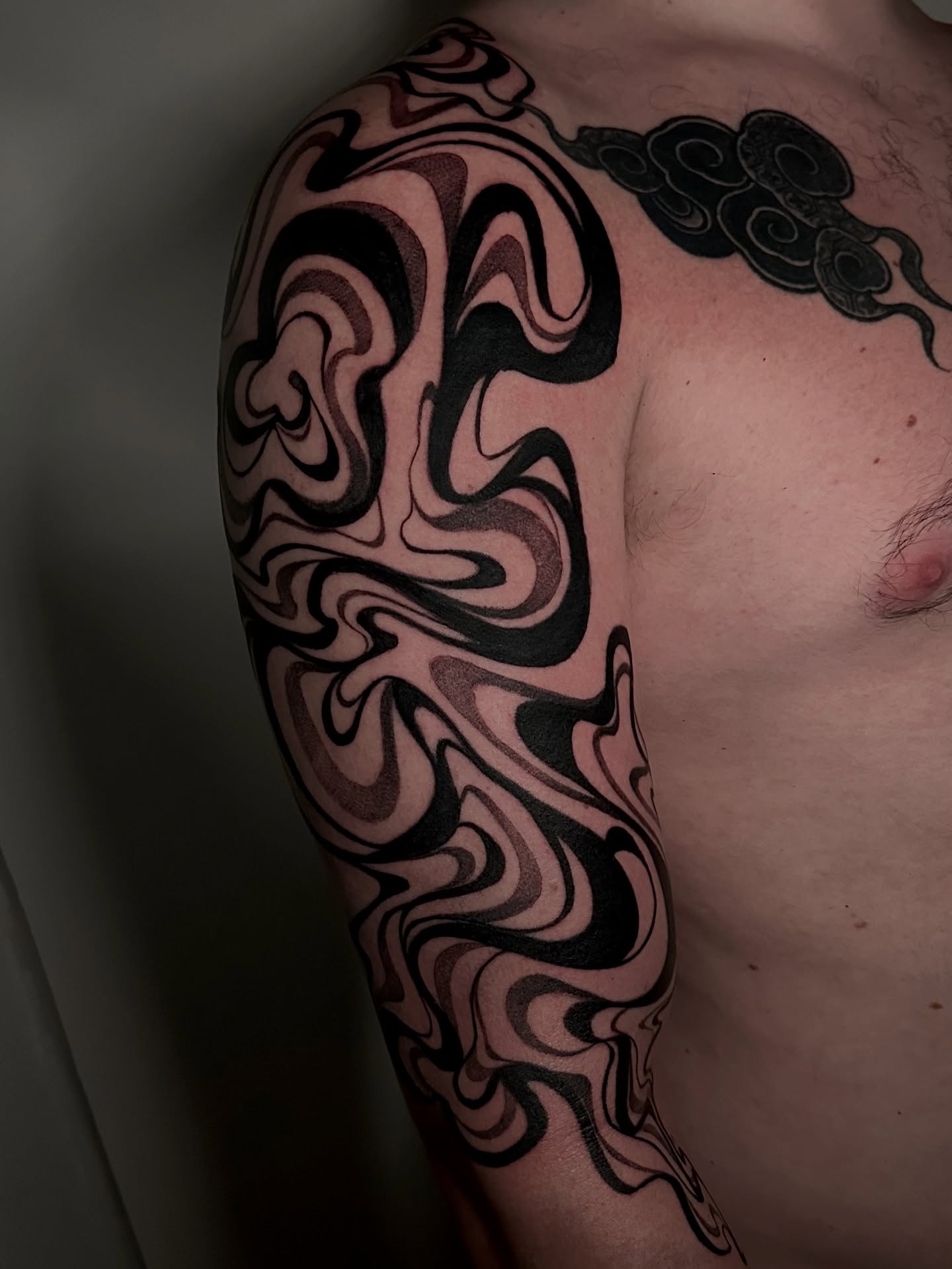 Abstract swirls black and grey tattoo on the shoulder by Crystal, Las Vegas, Nevada
