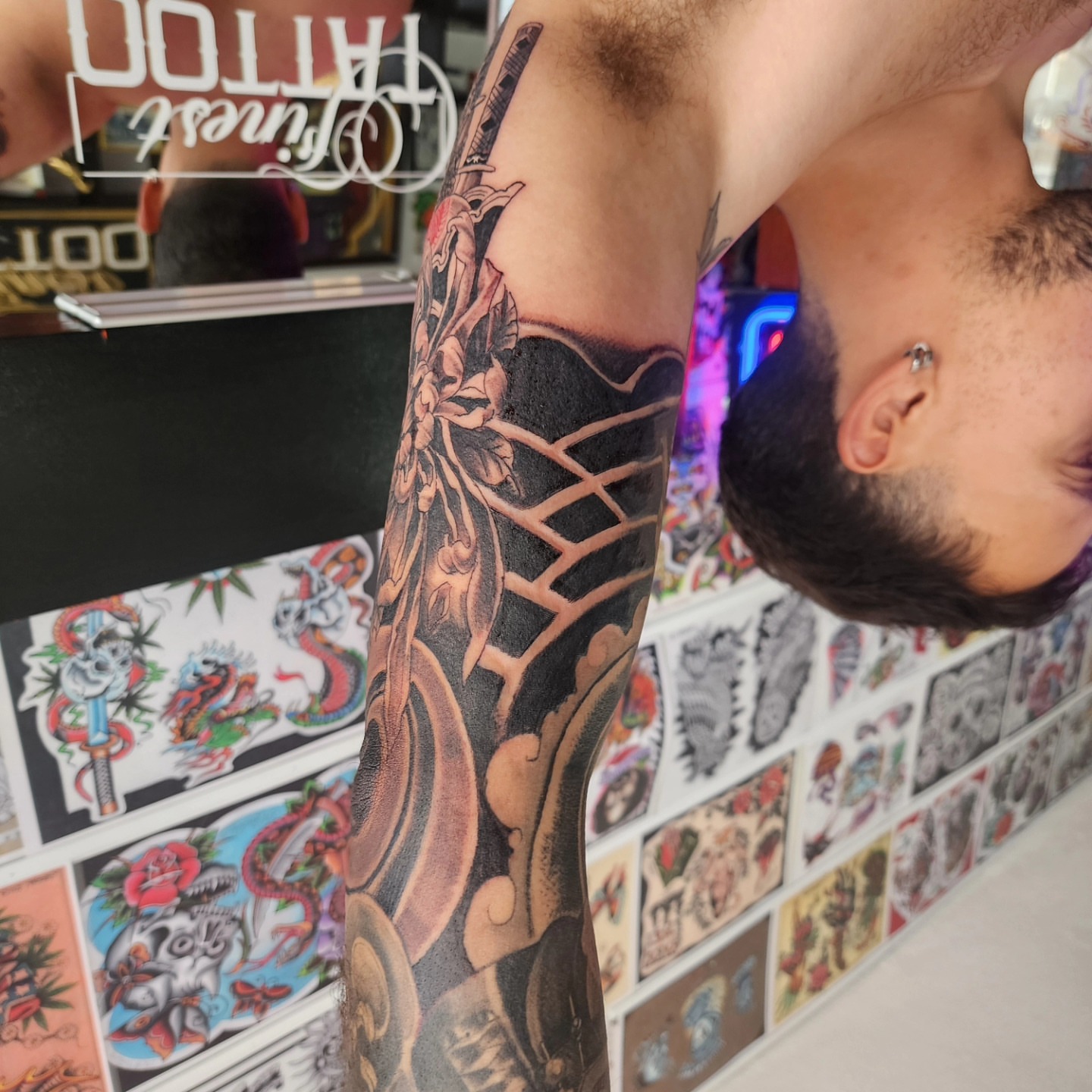 Dragon and flowers japanese irezumi tattoo on the forearm by Joe Garcia