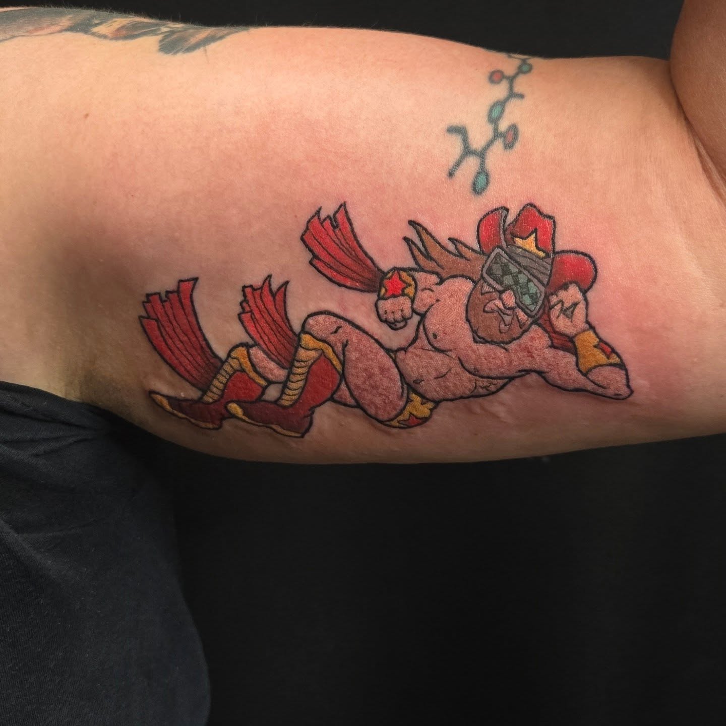 Red dragon American traditional tattoo on the forearm by Jamie Clinton