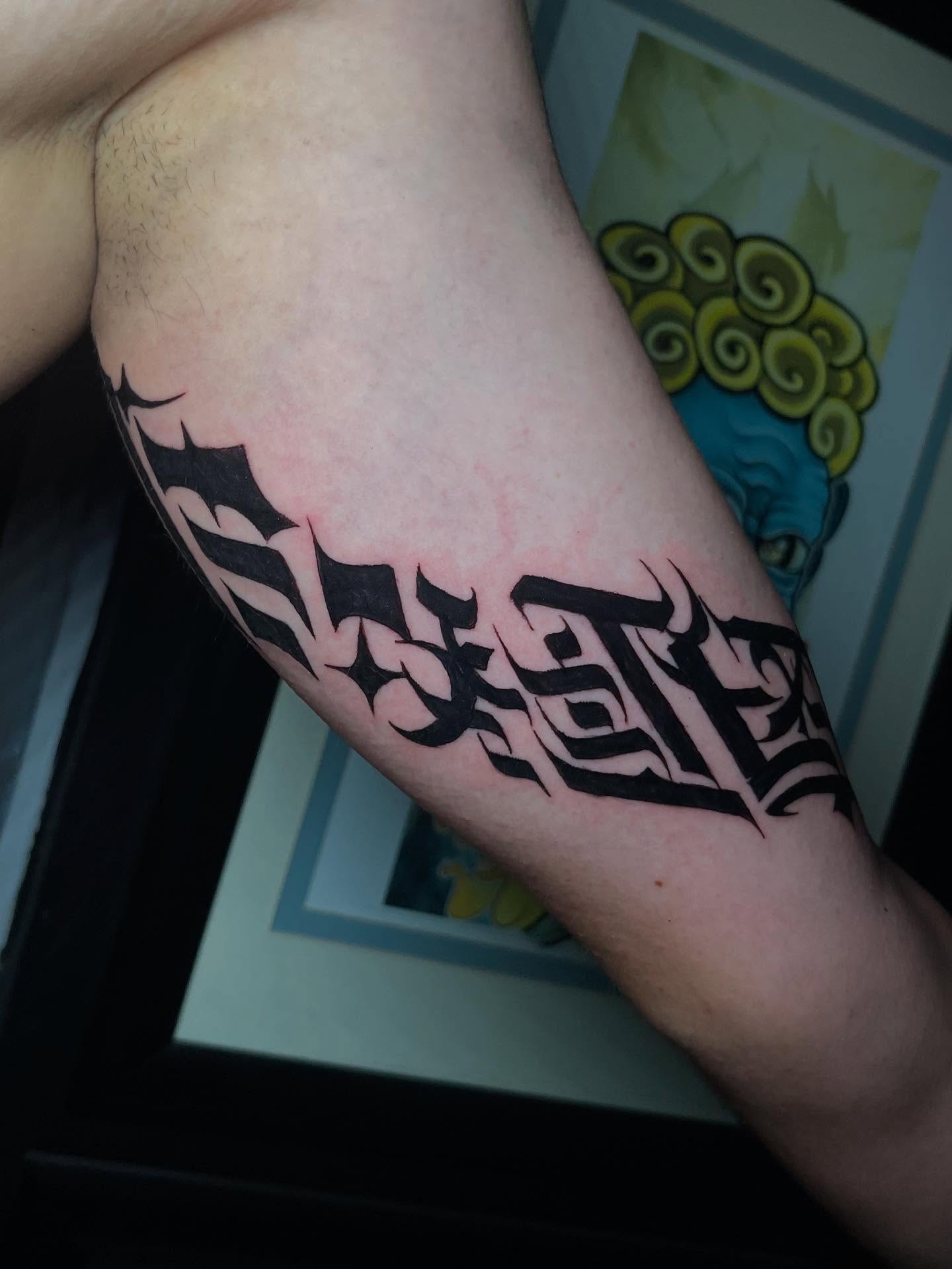 Tattoo by @wargski โ lettering_script