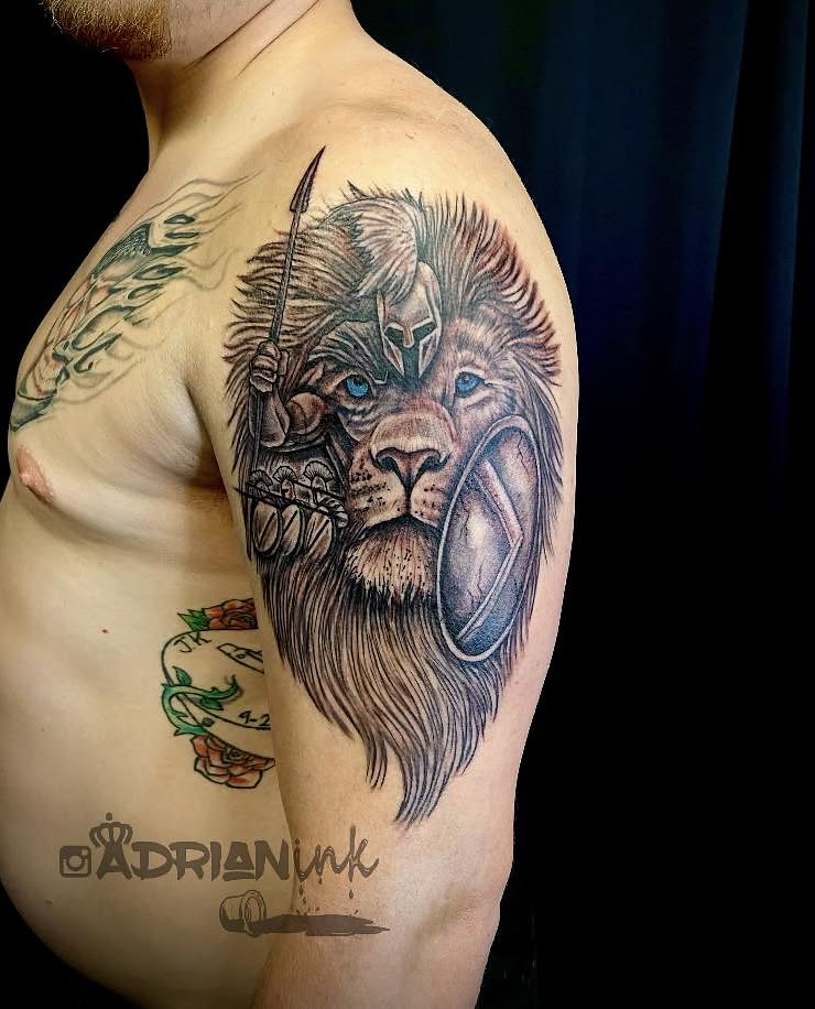 Lion realism tattoo on the shoulder by Adrian Shan Carr