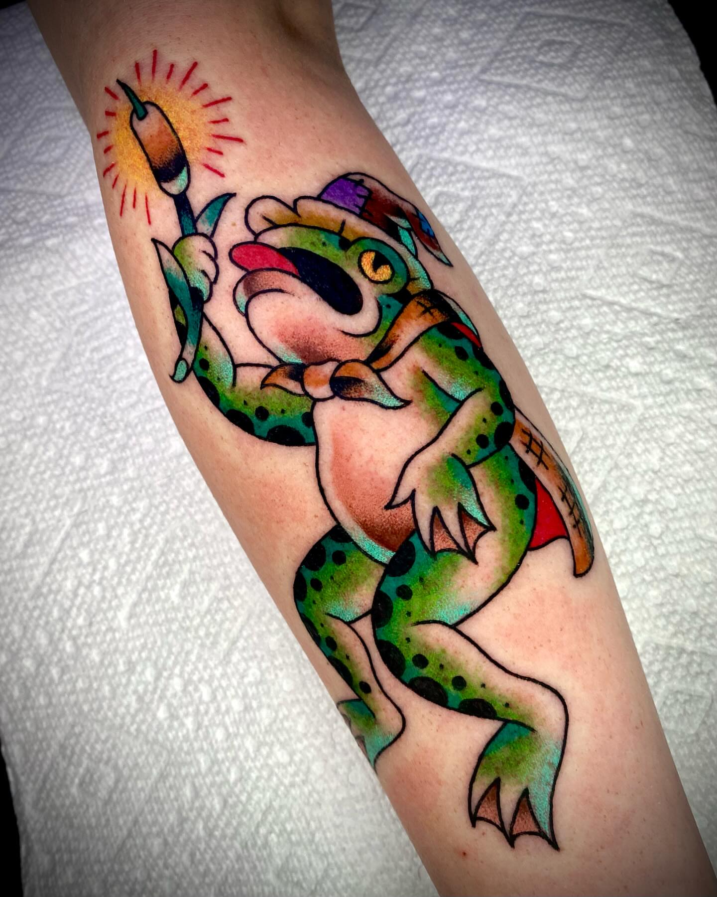 Frog American traditional tattoo on the forearm by Zach Knisley (Wiz)