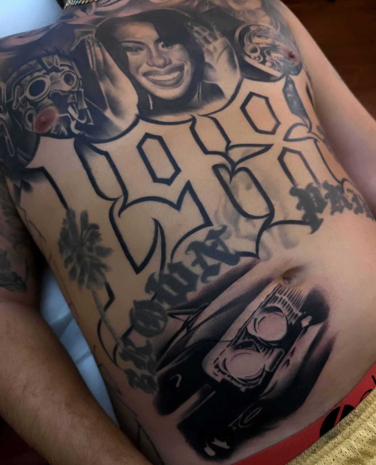 Portrait of a woman black and grey tattoo on the torso by TattooBoyTattoos