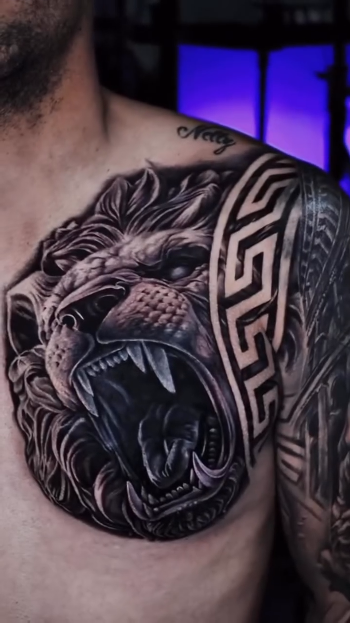 Lion head with greek key pattern realism tattoo by Francis nieves, Miami, Florida