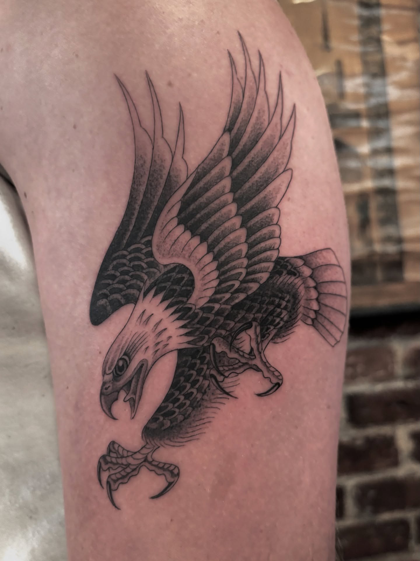 Eagle black and grey tattoo on the thigh by Jake Hodson, Nashville, Tennessee