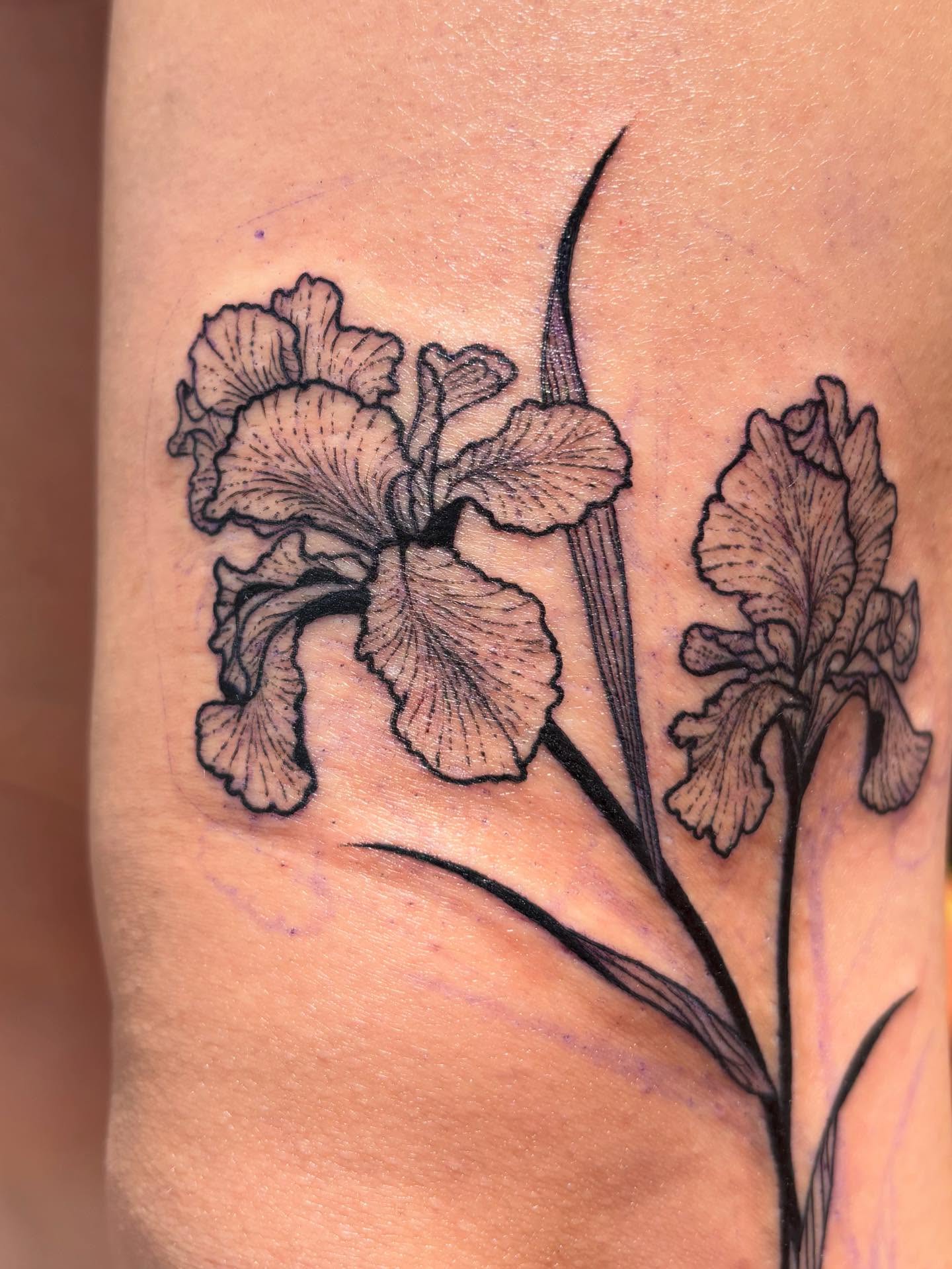 Iris flowers black and grey tattoo on the forearm by Anna Kathleen, Des Moines, Iowa