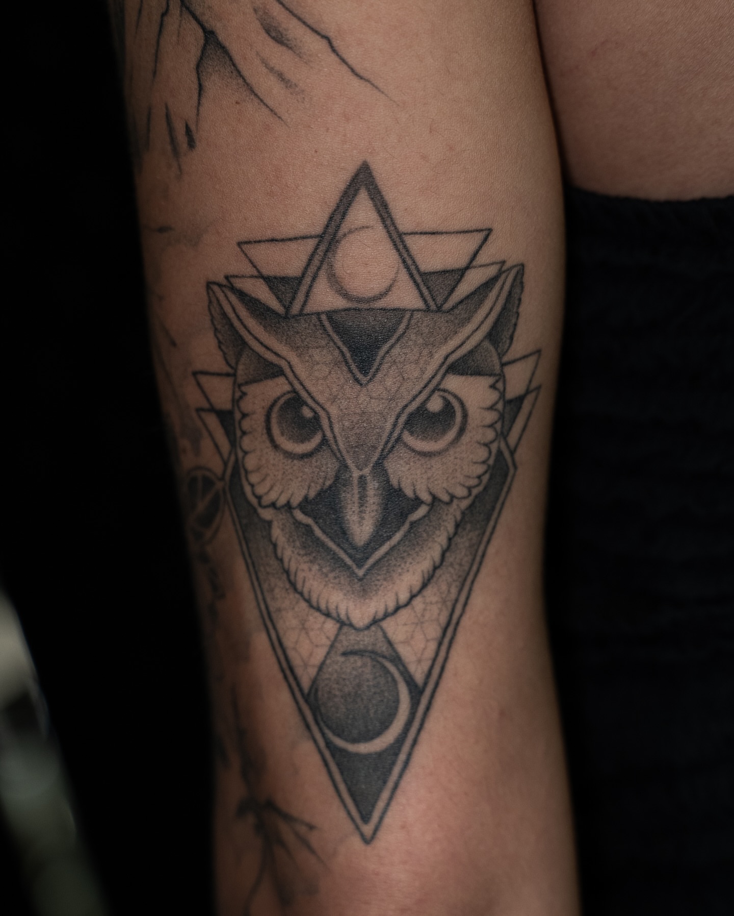 Owl geometric tattoo on the forearm by Chris Estrada