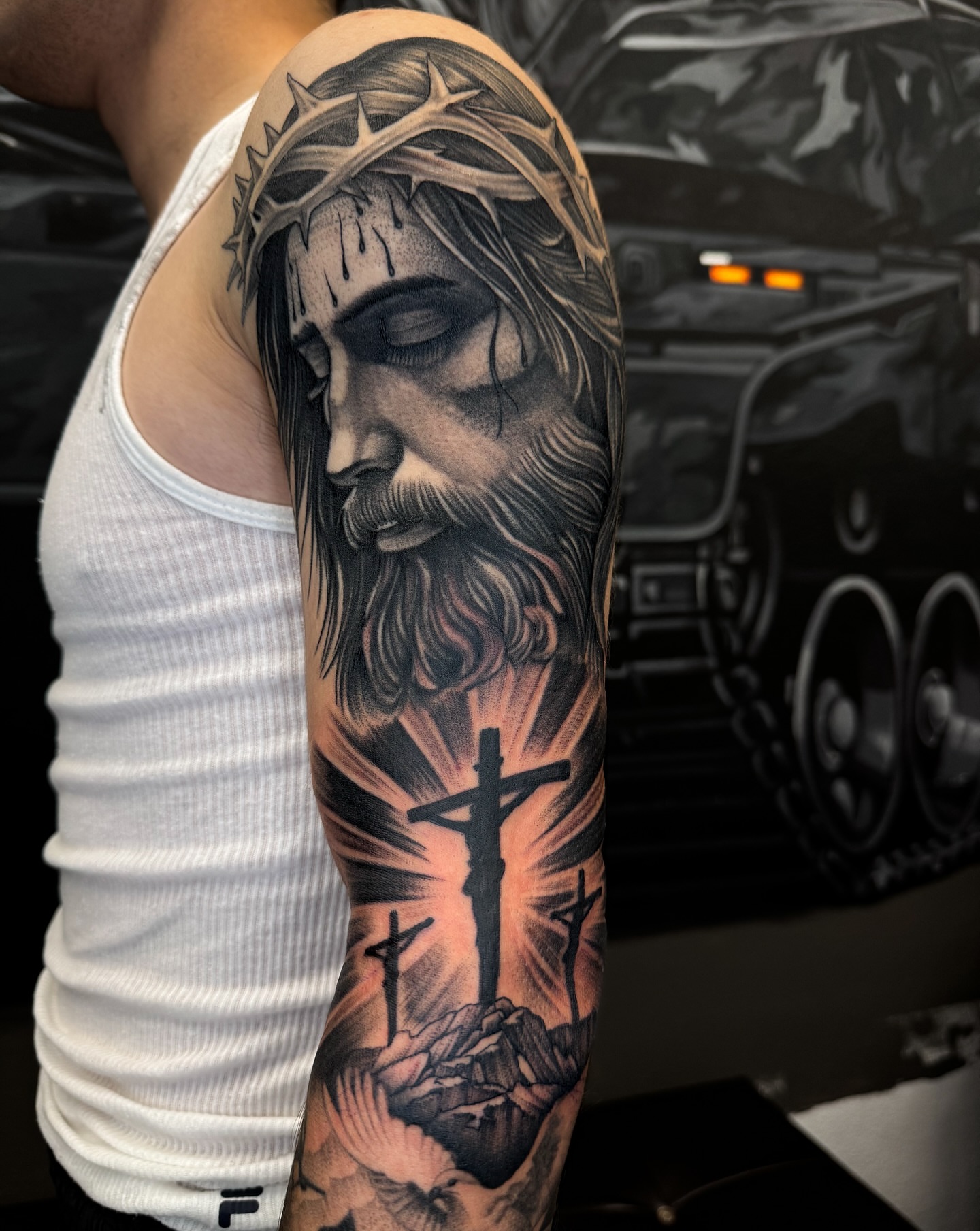 Religious figure realism tattoo on the forearm by Gabah🌹