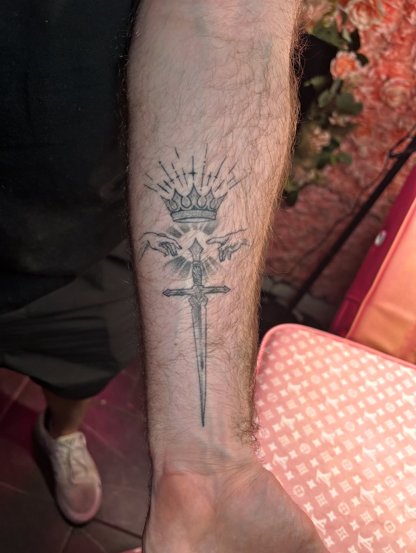 Sword and crown black and grey tattoo on the forearm by 𝒱𝒽𝓎𝓍𝒾𝓃