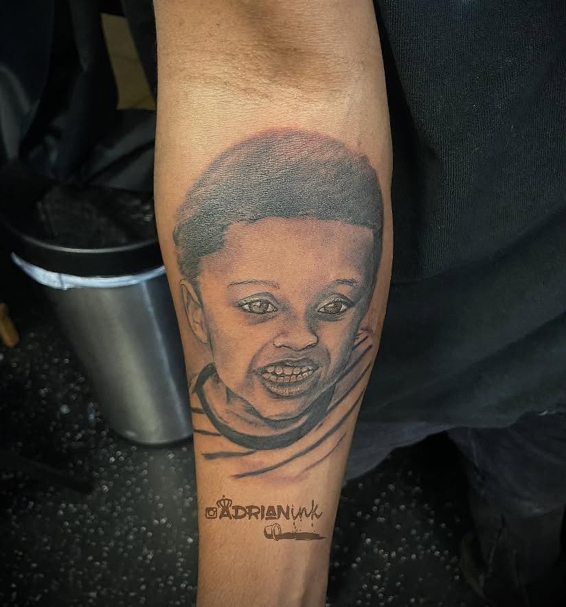 Portrait realism tattoo on the forearm by Adrian Shan Carr