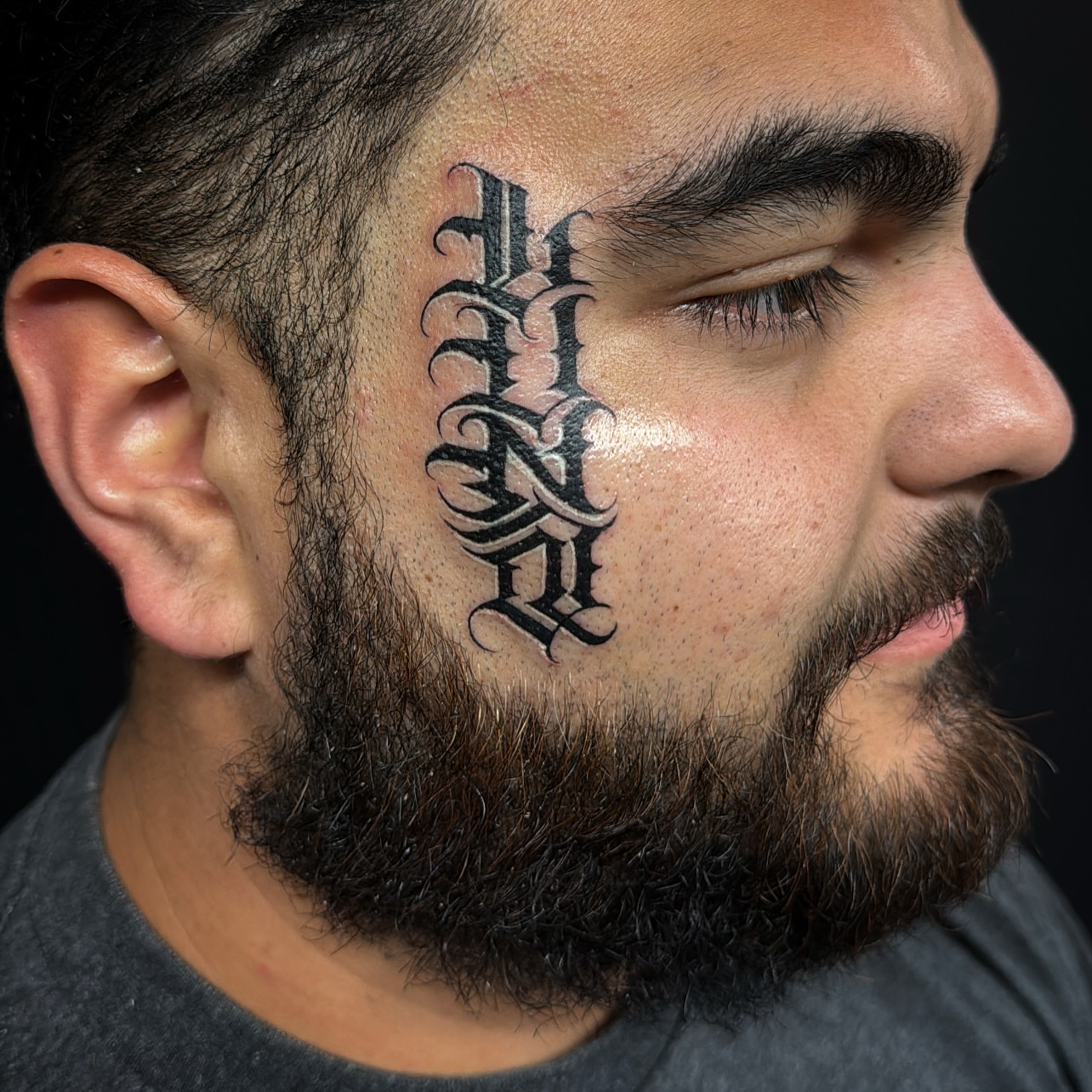 Gothic script tattoo on the head by El Pato, San Jose, California