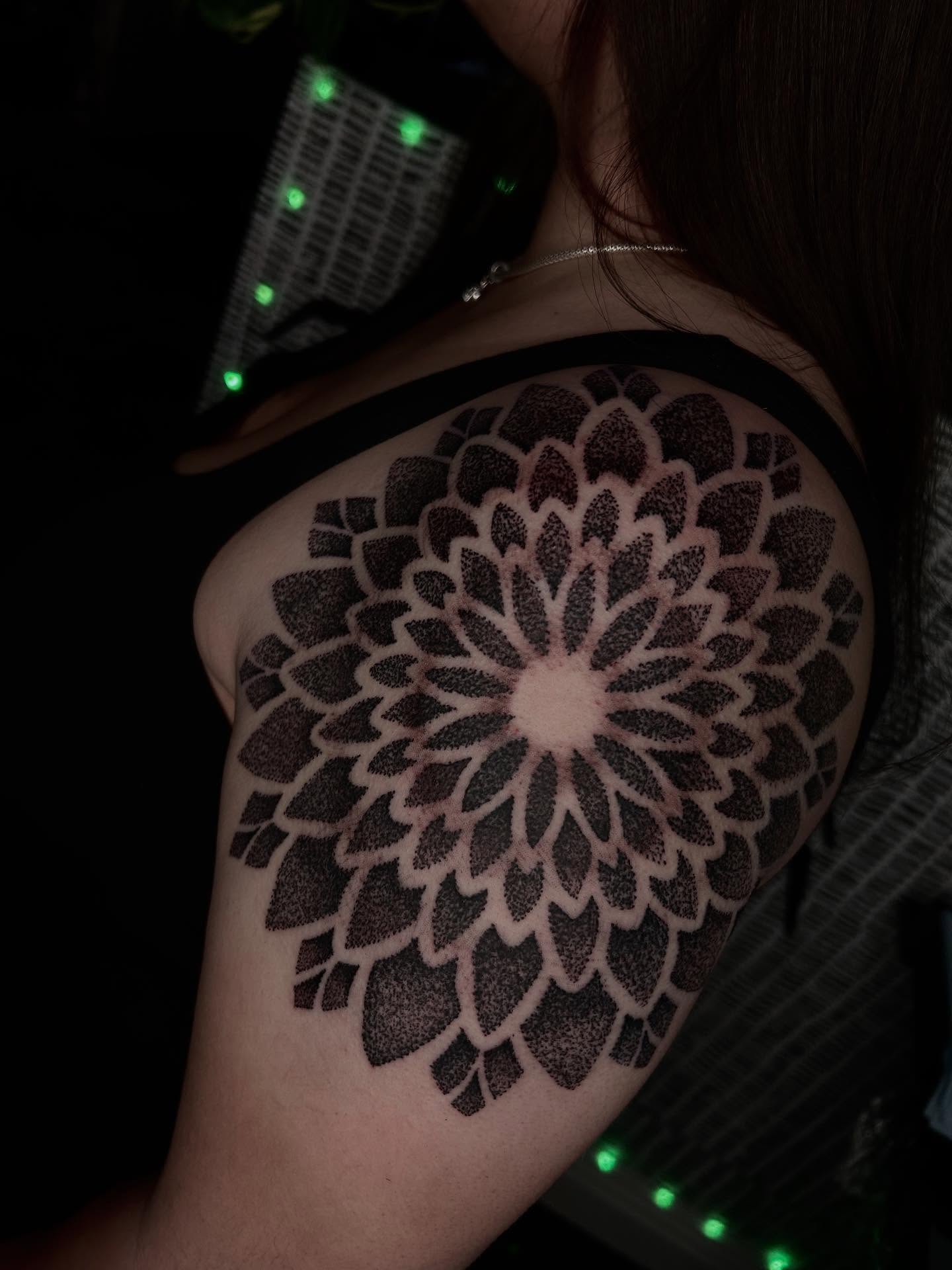 Geometric mandala dotwork tattoo on the shoulder by Jelly