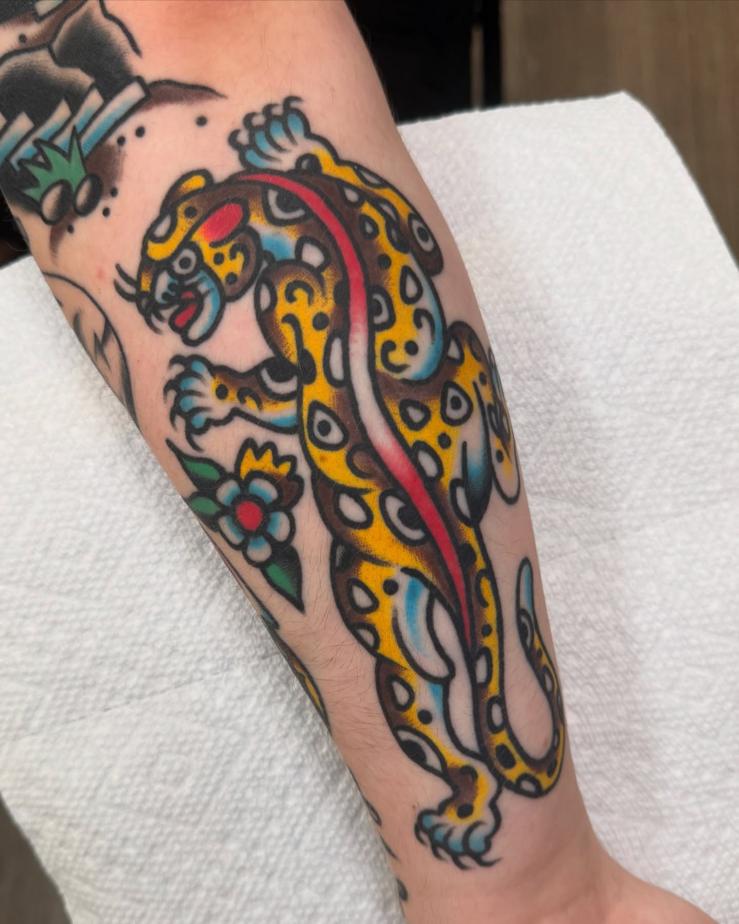 Jaguar American traditional tattoo on the forearm by Cullen Bleser Quinn