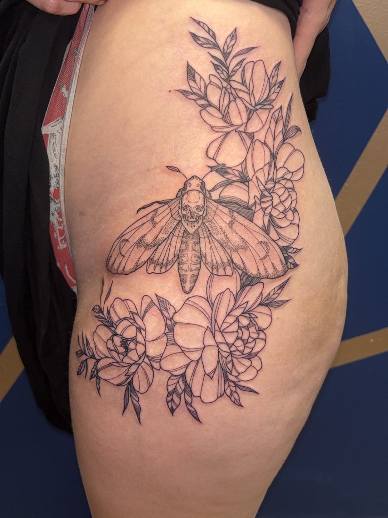 Moth and flowers realism tattoo on the thigh by ✨Cyerra Lynne✨