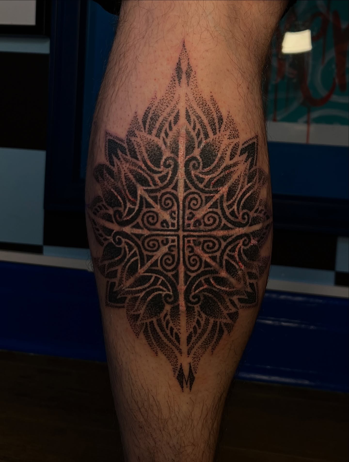 Lotus flower dotwork tattoo on the forearm by Bombay Pain Co.