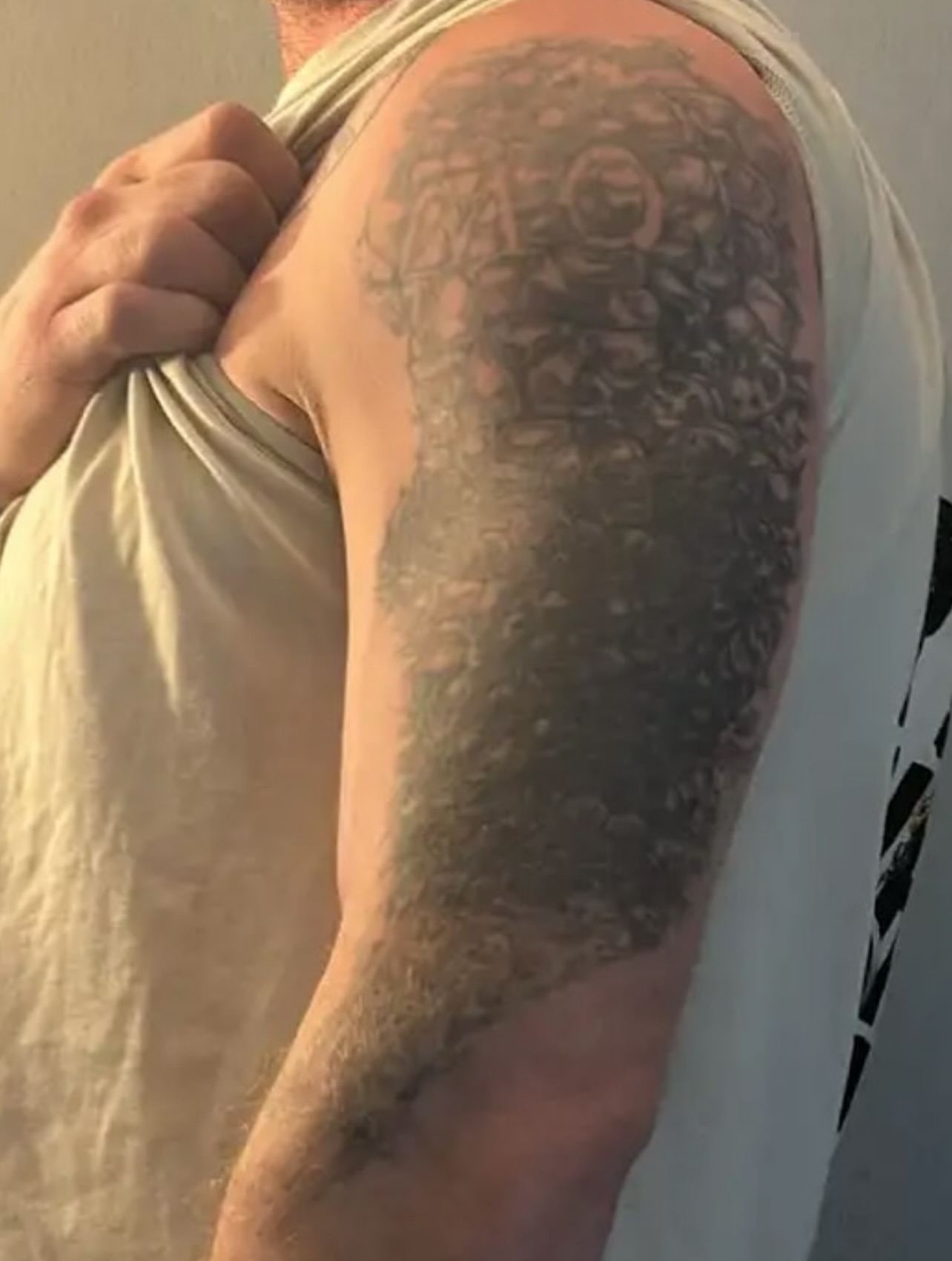 Jungle scene realism tattoo on the upper arm by Bombay Pain Co.