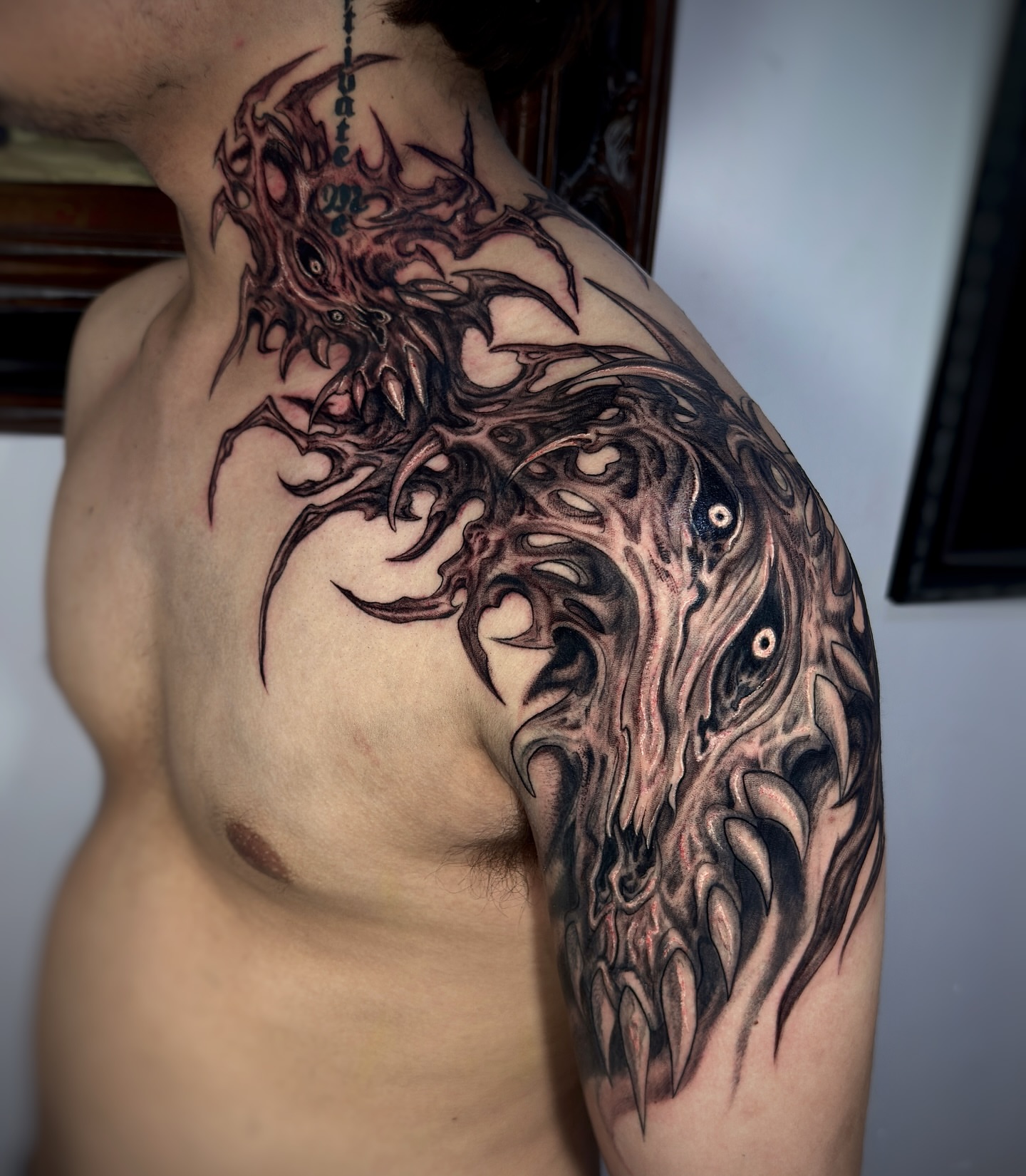 Monster dark realism tattoo on the shoulder by Jemin Ren