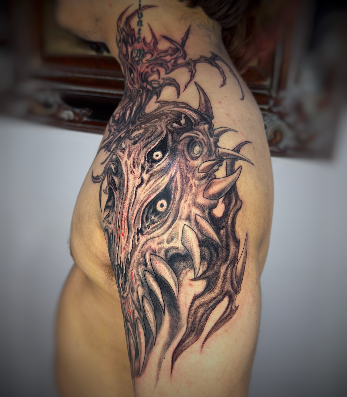 Demon dark realism tattoo on the shoulder by Jemin Ren