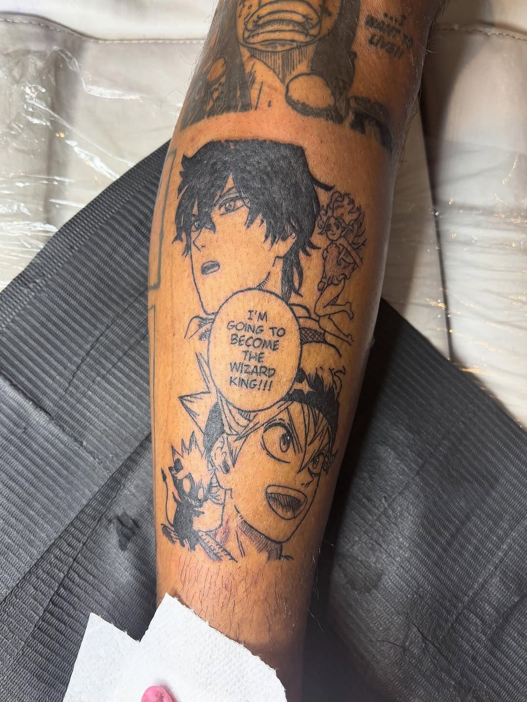 Anime characters with speech bubble anime tattoo on the forearm by Room 707 Tattoo 🍰🍓