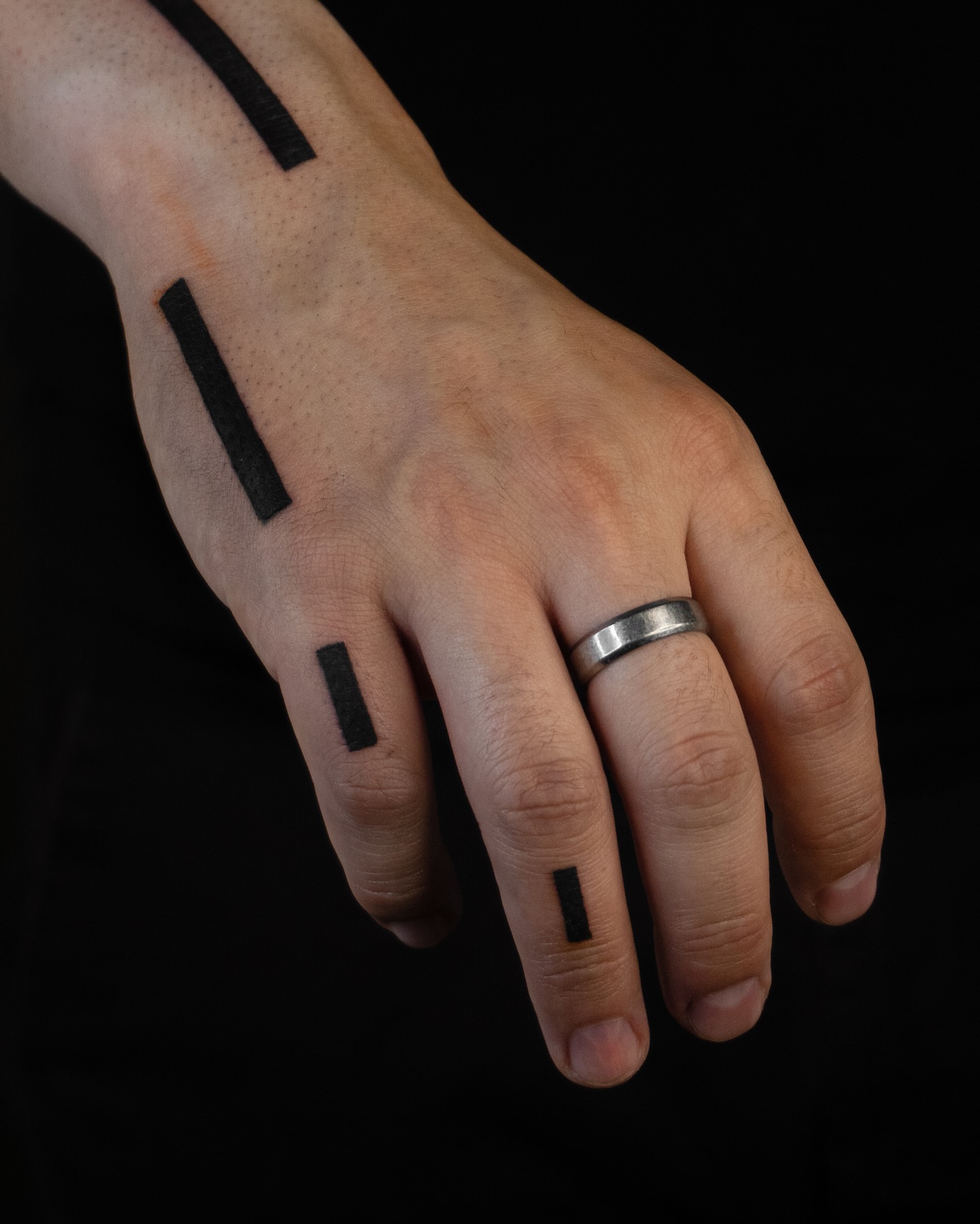 Rectangles black and grey tattoo on the hand by Pietro Moleti