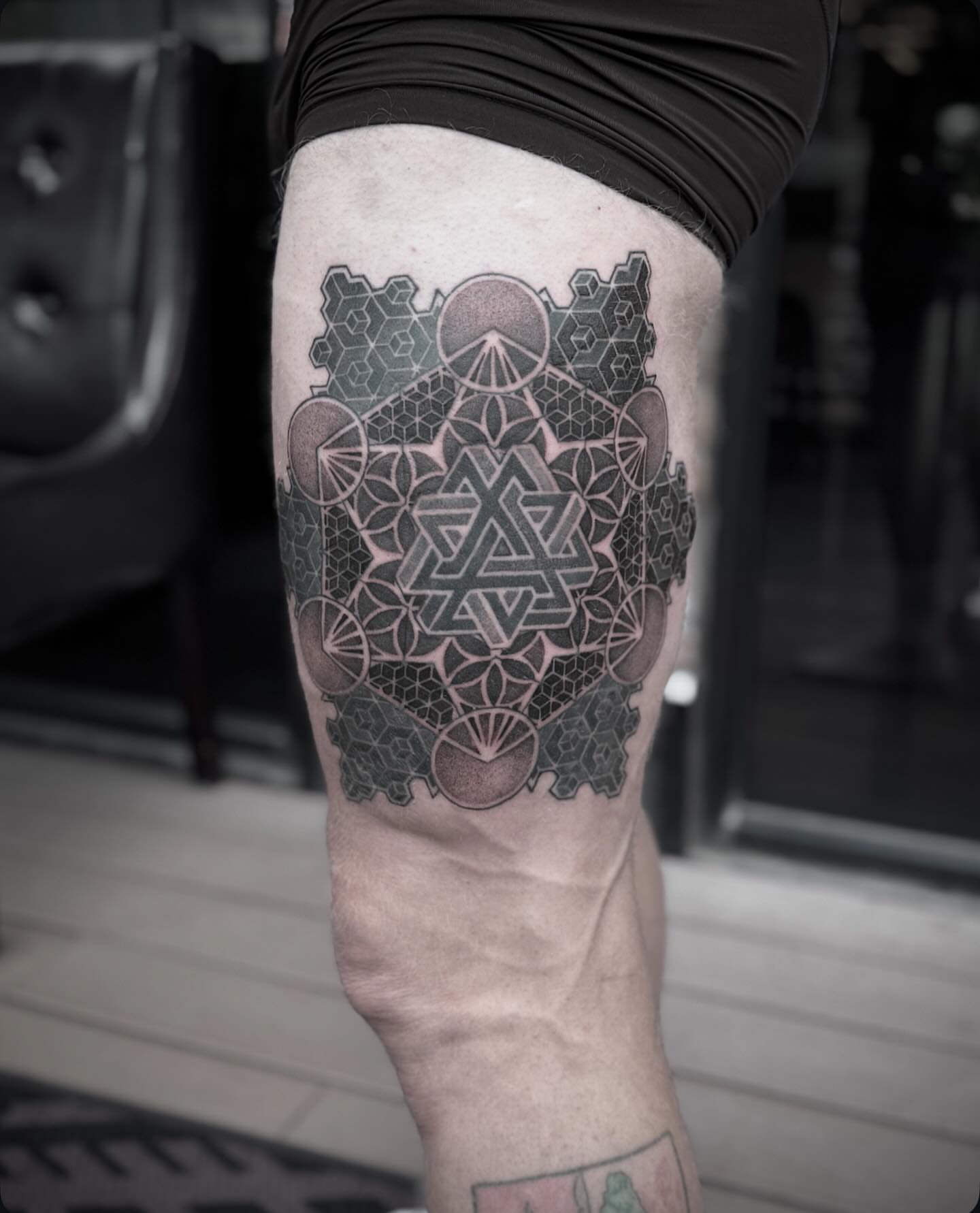 Geometric design geometric tattoo on the thigh by Jymi Calkins