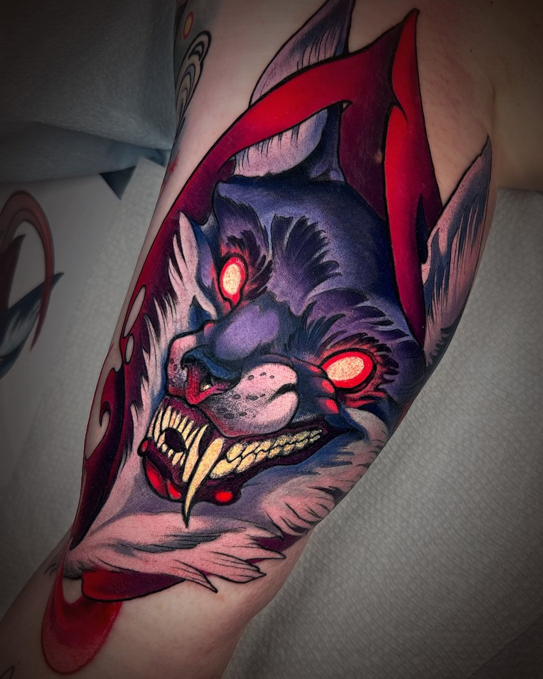 Demon head dark realism tattoo on the forearm by Kate Erso
