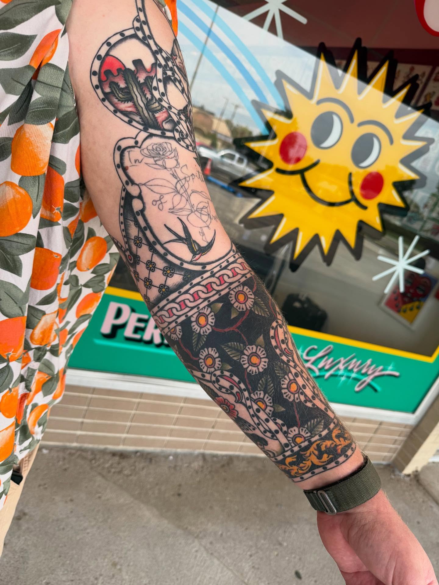 Floral and geometric patterns American traditional tattoo on the forearm by Cody Petkus