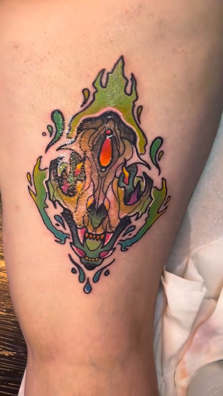 Animal skull with flames dark realism tattoo by Riley Oats