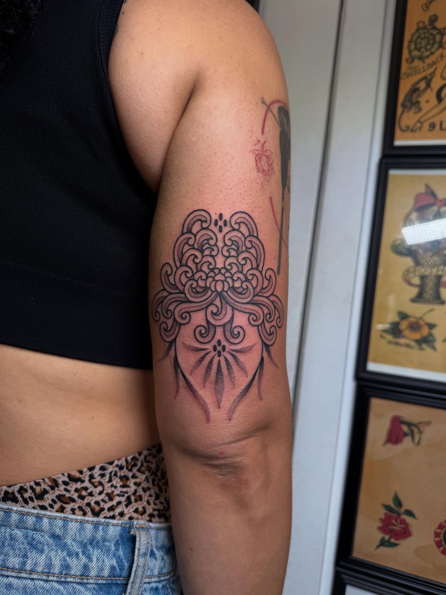 Floral mandala black and grey tattoo on the forearm by Erin Shea