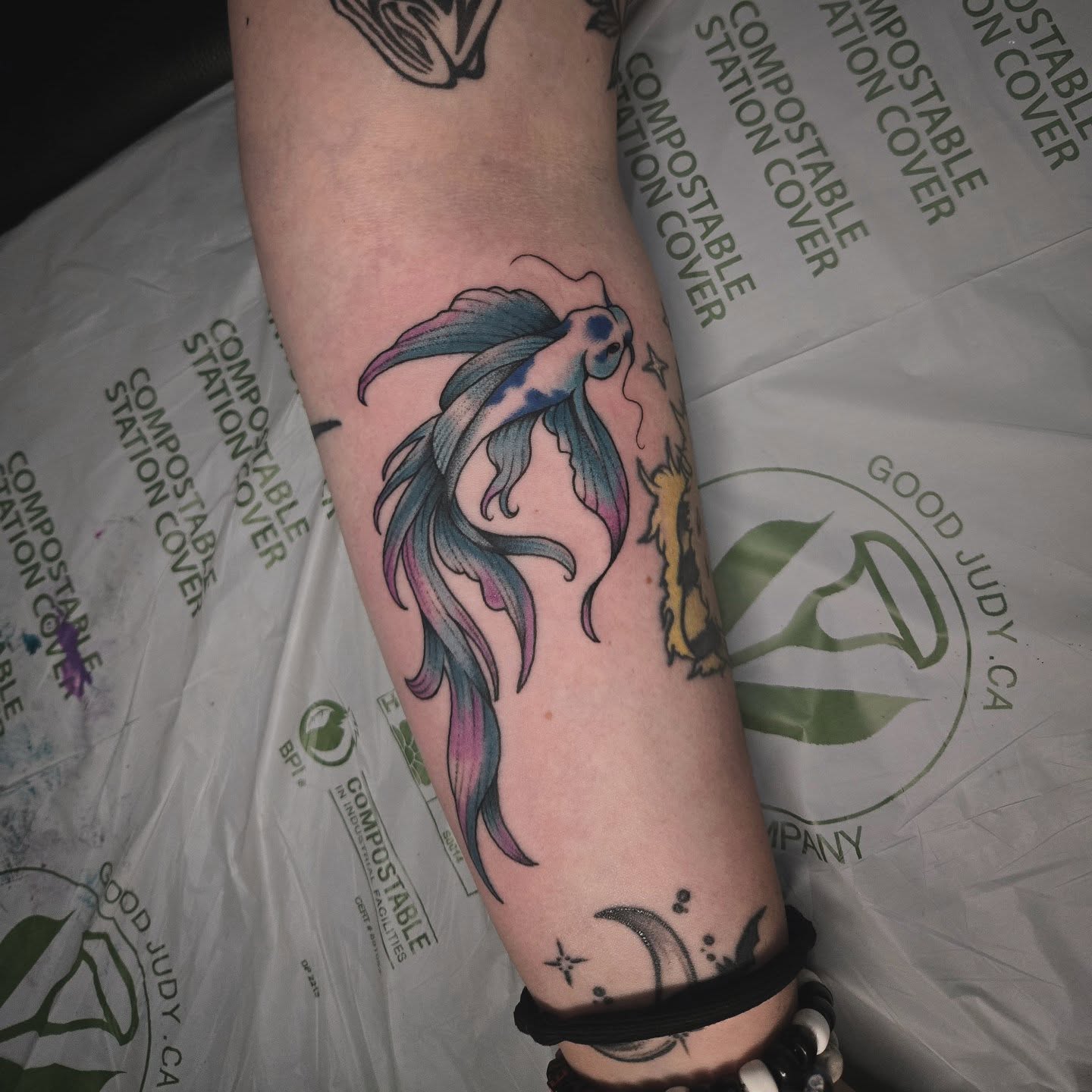Goldfish new school tattoo on the forearm by Alexandra Colella ✨️