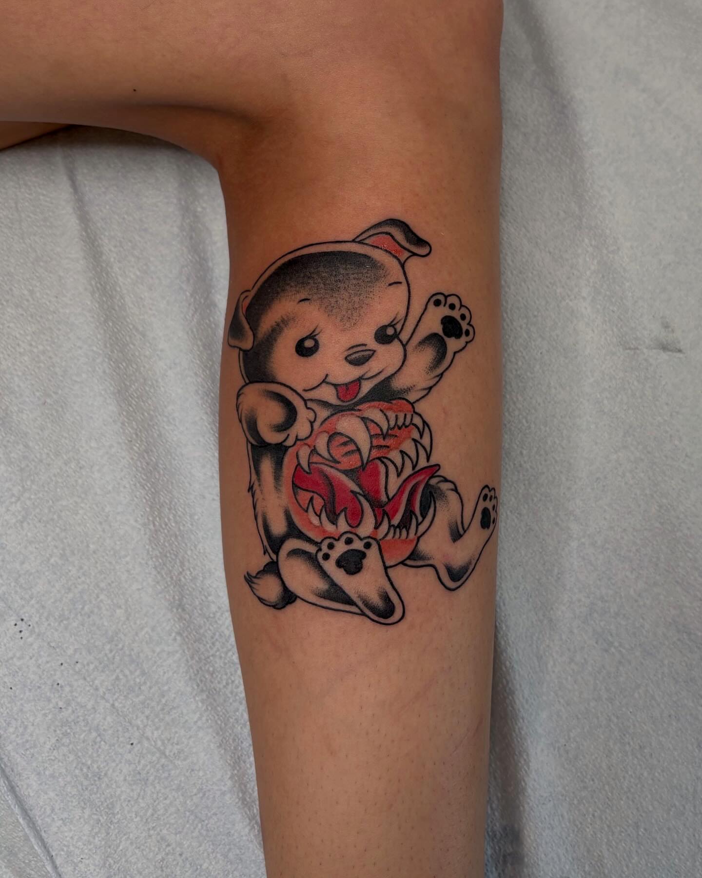 Dog with heart American traditional tattoo on the forearm by Lily, Eugene, Oregon
