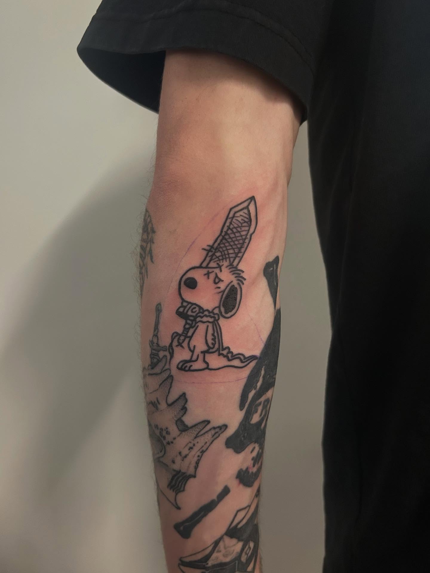 Snoopy American traditional tattoo on the forearm by Cameron 🩸👻