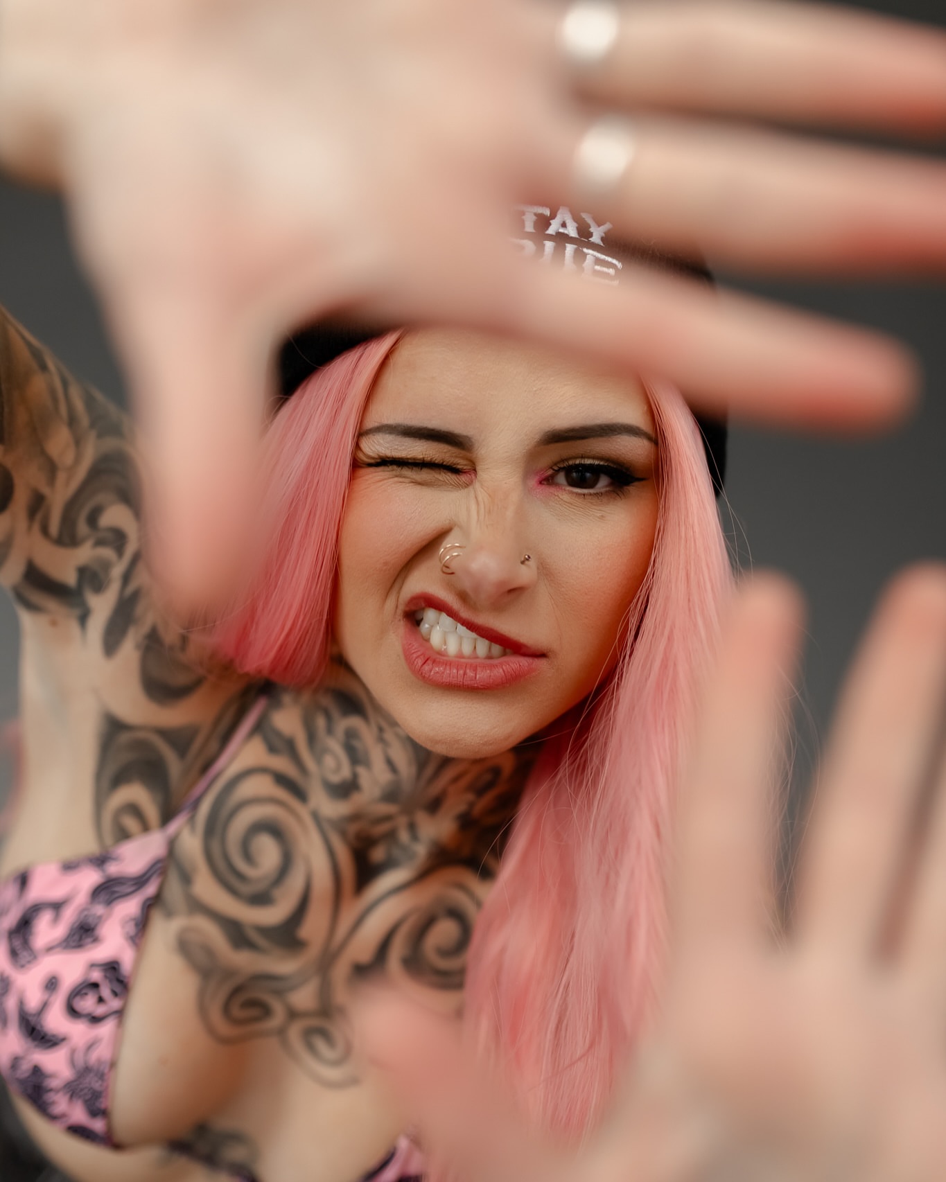 Pink hair black and grey tattoo on the chest by Jordyn Tinney