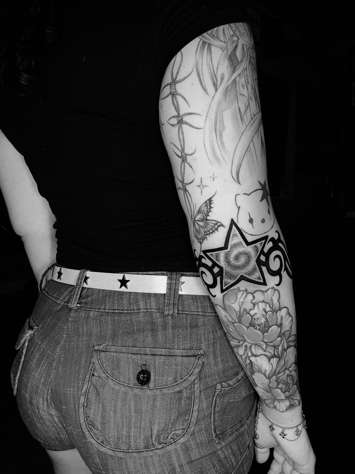 Barbed wire and floral black and grey tattoo on the forearm by Xena