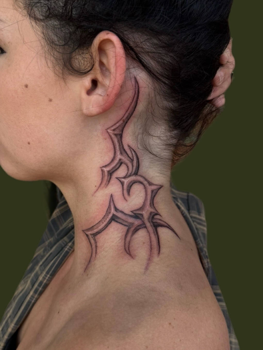 Tribal design tribal tattoo on the neck by Diana
