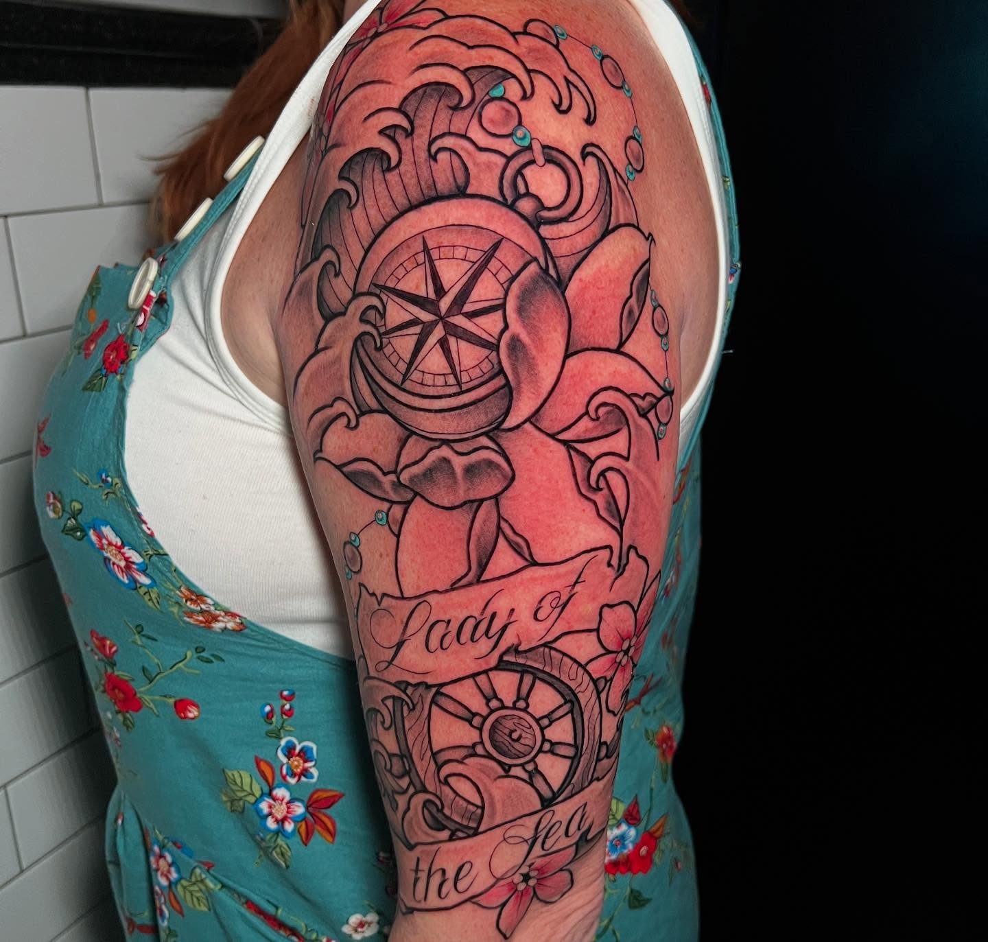 Compass and rose American traditional tattoo on the upper arm by l y n d s e y r i c k e t t s