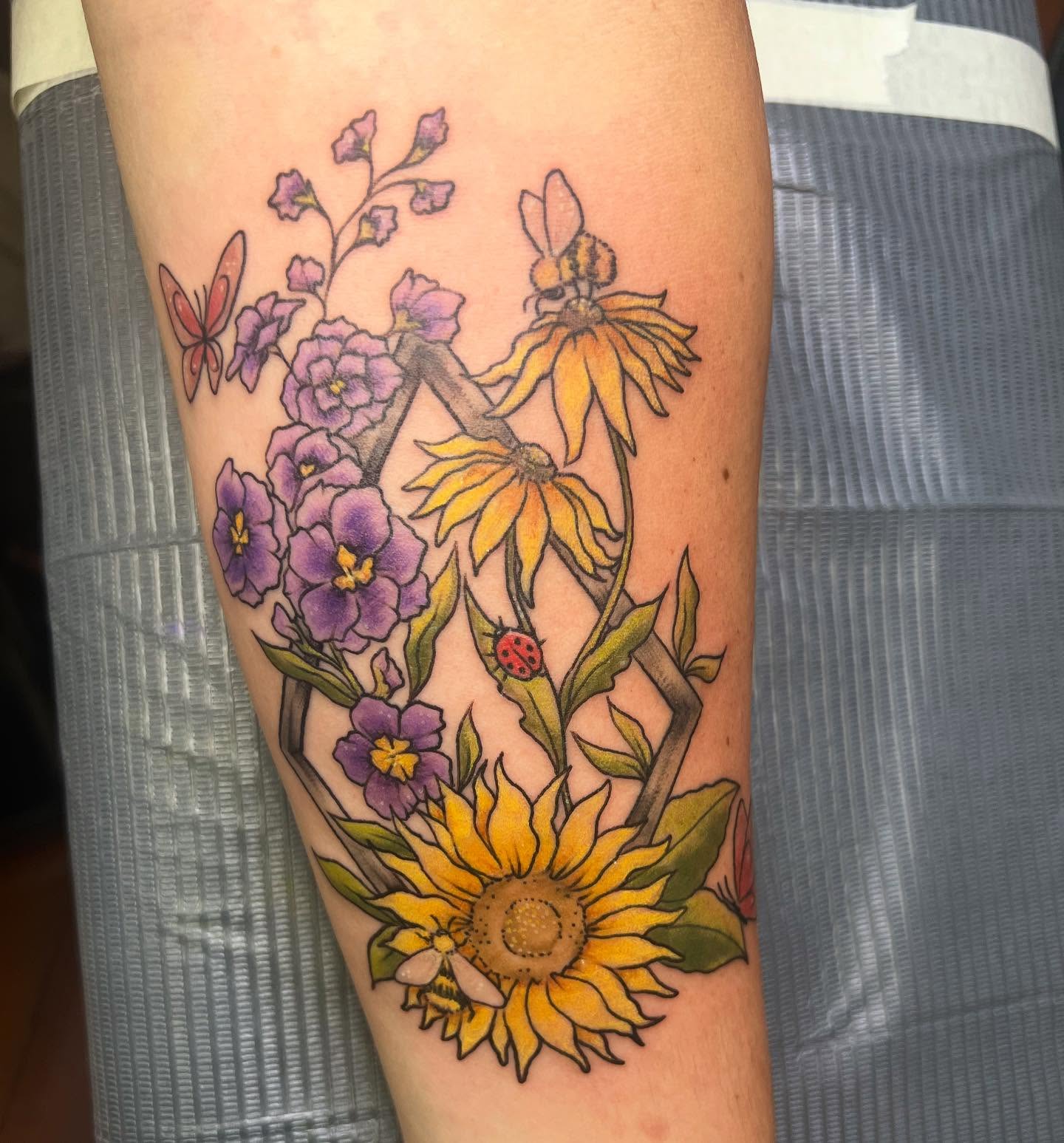 Sunflowers and butterflies new school tattoo on the forearm by Tattoos by Ash, Crystal Lake, Illinois