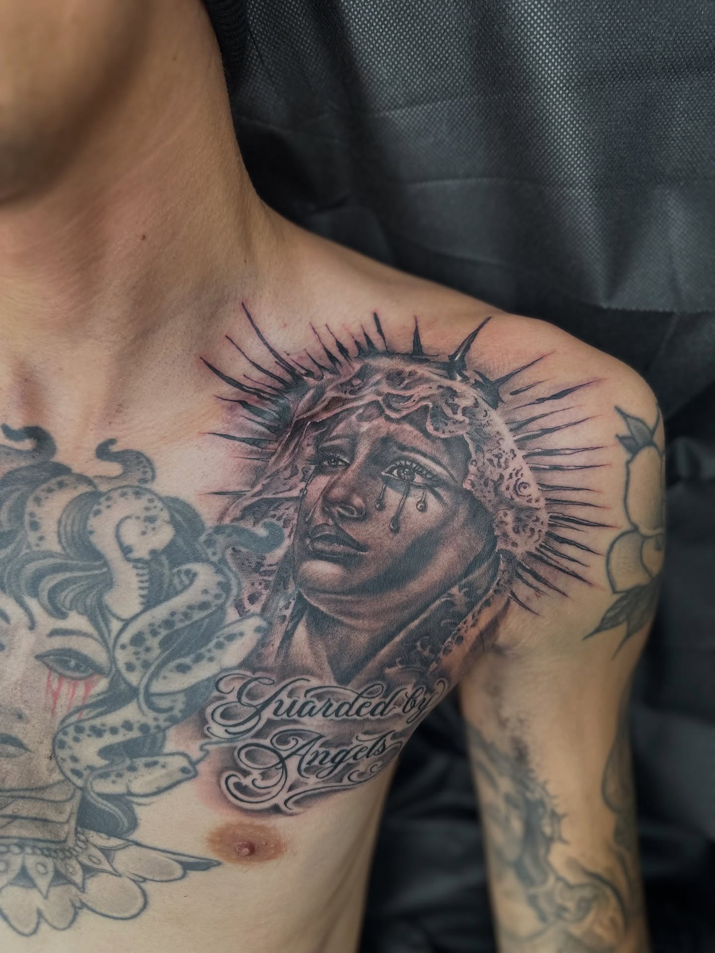 Religious figure realism tattoo on the chest by Stevie O'Dell