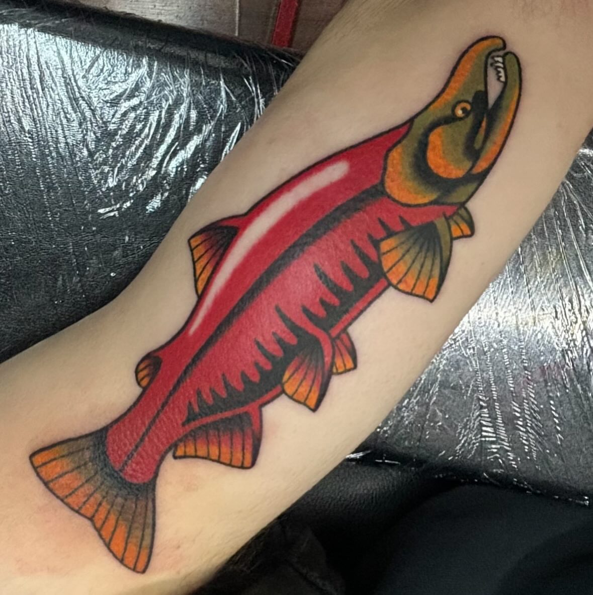 Salmon American traditional tattoo on the forearm by ๐๐๐ฑ๐ฑ๐ฌ๐ฌ ๐๐ฏ๐ฑ๐ฆ๐ฐ๐ฑ
