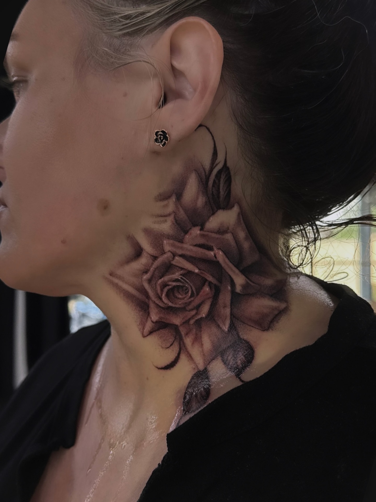 Rose realism tattoo on the neck by Grace P