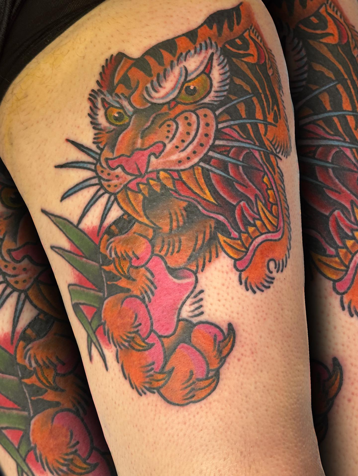 Tiger American traditional tattoo on the thigh by ᴄʜʀɪs ᴀᴠᴇʀᴀ
